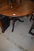 A 19th Century oak pedestal table having circular top turned column and triple splay legs,