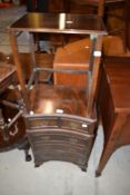 A reproduction Regency bedside chest of concave form and mahogany occasional nesting table
