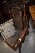 A Victorian beech frame folding campaign style chair having canework seat and back