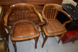 A pair of early 20th Century oak office style armchairs