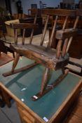 A rustic low rocking chair