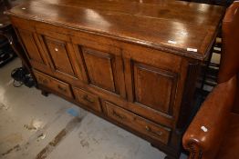 An 18th Century oak four panel mule chest, adapted