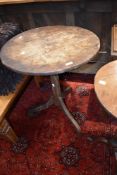 A 19th Century oak pedestal table having circular top, faceted column and triple splay legs,