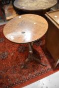 A 19th Century oak pedestal table having circular top, turned column and triple splay legs, diameter