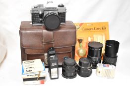 A Praktica PLC3 SLR camera with a Prakticar MC 50mm 1,8 lens, a Prakticar MC 135 2,8 lens, a