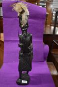 A carved wood African tribal figurine.