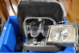 An insulated backpack picnic hamper, slate and brass effect mantel clock and three vintage