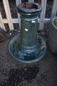 A glazed bird bath