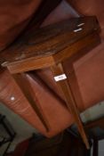 An early 20th Century Continental style octagonal occasional table having extensive mythical and