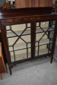 A late 19th/early 20th Century astral glazed display having gadrooned edge