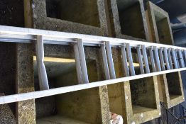 A set of aluminium extending ladders