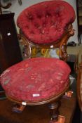 A Victorian mahogany frame low seat nursing chair having button back