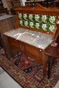 An Edwardian tile back washstand