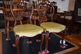 A pair of Victorian mahogany balloon back dining chairs