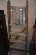 A set of vintage wooden step ladders