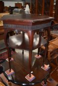 A late Victorian mahogany occasional table having hexagonal top and undershelf on fine legs