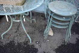 A modern metal garden table and set of four chairs
