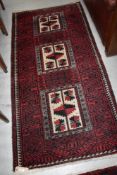 A traditional Persian style rug, approx. 175 x 88cm