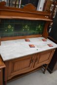 A Victorian satinwood tile back washstand