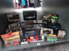A shelf of modern diecasts including Corgi, Burago, Rio etc, all boxed, approx 20