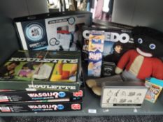 A shelf of mixed vintage Toys and Games including Wasgij Puzzles. Berwick Roulette, boxed Drone etc