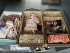 A early 20th century SFBJ bisque headed doll having fixed open eyes, open mouth with four teeth