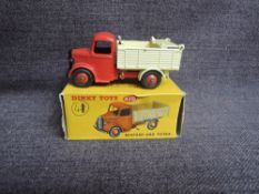 A Dinky diecast, 410 Bedford End Tipper, Red & Cream, in original box