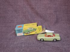 A Corgi diecast, 222 Renault Floride in metallic green with red interior, in original box