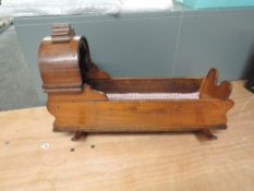 A traditional mahogany Doll's Crib on rocking base, length 56cm, height 36cm
