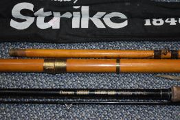 A Daiwa sensor carbon spin 3.05m, A Shakespeare strike 3.90m and a wooden boat rod