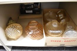 A collection of vintage glass lamp shades including mid century peach shade having dappled effect.