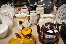 A mixed lot of ceramics including late 19th century tea pot and trivet with relief design reading'
