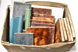 A selection of miscellaneous ceramic tiles, mainly mottled brown/treacle glaze, marked MAWCO to