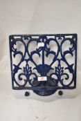 A modern cast metal recipe or book stand