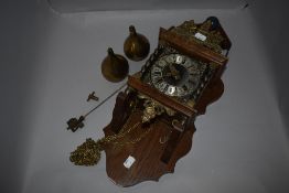 A vintage wall mounted Franz Hermle style clock