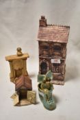 A small collection of studio pottery items, comprising a model house, dog kennel, fireplace and