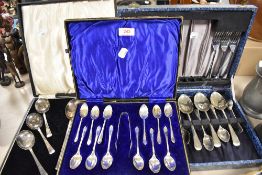 A selection of vintage flatware in boxes, knives and forks, spoons and sugar nips to be included.