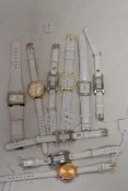 Ten ladies/girls fashion watches, all having white straps.
