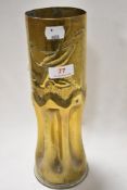 A military ammunition shell worked as Trench art with fluted base and bird design 29cm tall approx