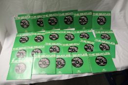 A large lot Beatles reissues 45's - all very clean and likely unplayed - 23 in total - an