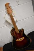 An Ovation Celebrity mandolin, model MCS148, with padded gig bag