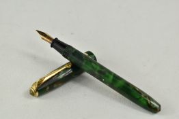 A Conway Stewart Dinkie 550 lever fill fountain pen in green marble with single band to the cap