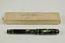 A Conway Stewart Dinkie 560 lever fill fountain pen in blue marble with gold veining having single