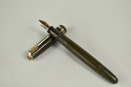 A Parker Duofold pump fill fountain pen in green with decorative band to cap having Parker 30 nib.