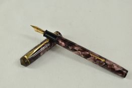 A Conway Stewart 388 lever fill fountain pen in rose marble with single broad band and two narrow