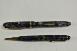 A Burnham B59 lever fill fountain pen in grey marble with three narrow bands to the cap having