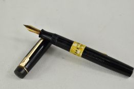 A Croxley lever fill fountain pen in black with single narrow band to cap having Dickenson nib.