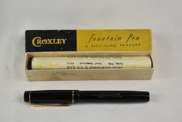 A boxed Croxley lever fill fountain pen in black with single narrow band to cap having Dickenson