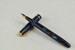 A boxed Conway Stewart Dinkie 540 leverfill fountain pen in green black marble having a Conway