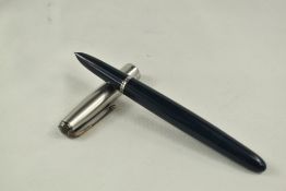 A Parker 51 vacu fill fountain pen in cedar blue with lustiloy cap having diamond to gold clip.